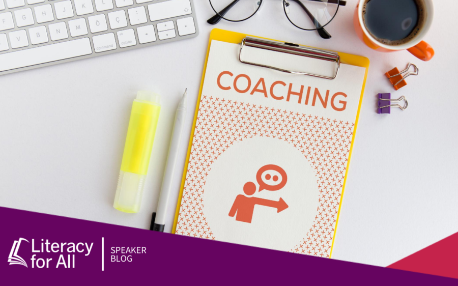 Image of a desk with a booklet that says "coaching" on the cover.